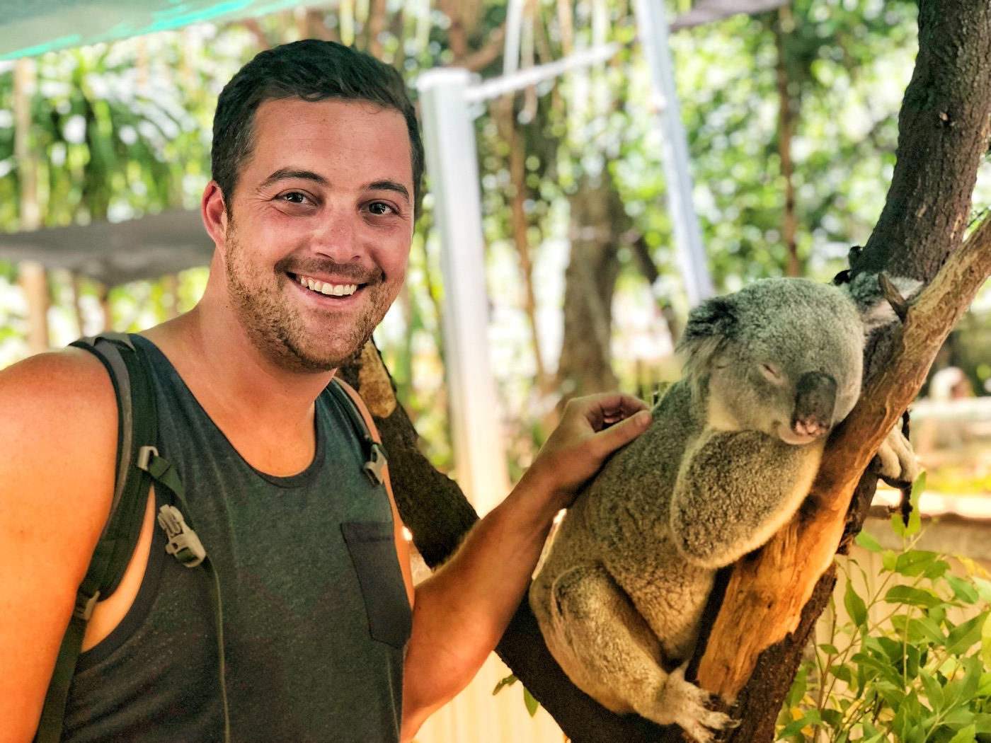 Mike beside a koala in Queensland