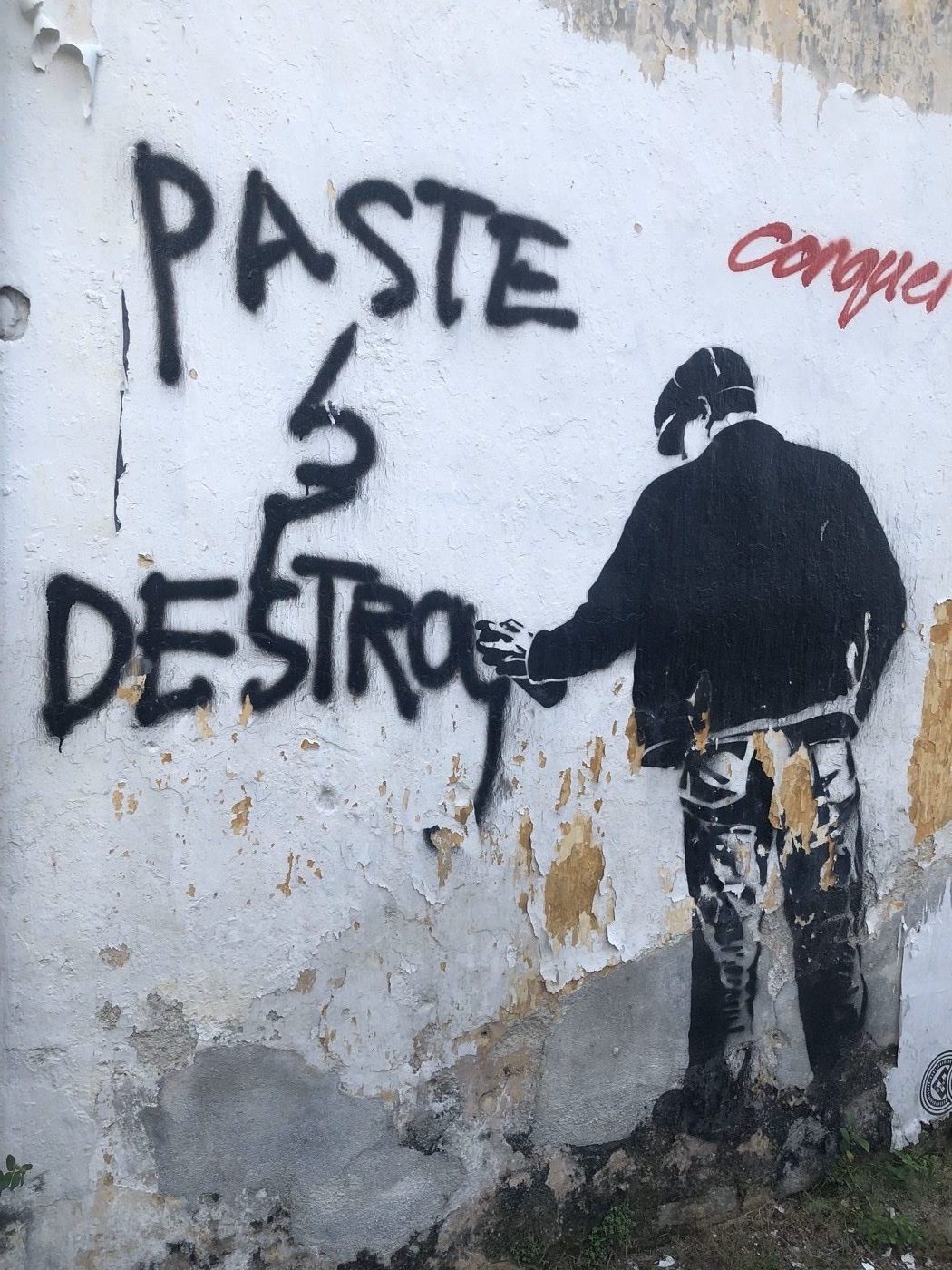 Paste and destroy street art painted on a weathered wall